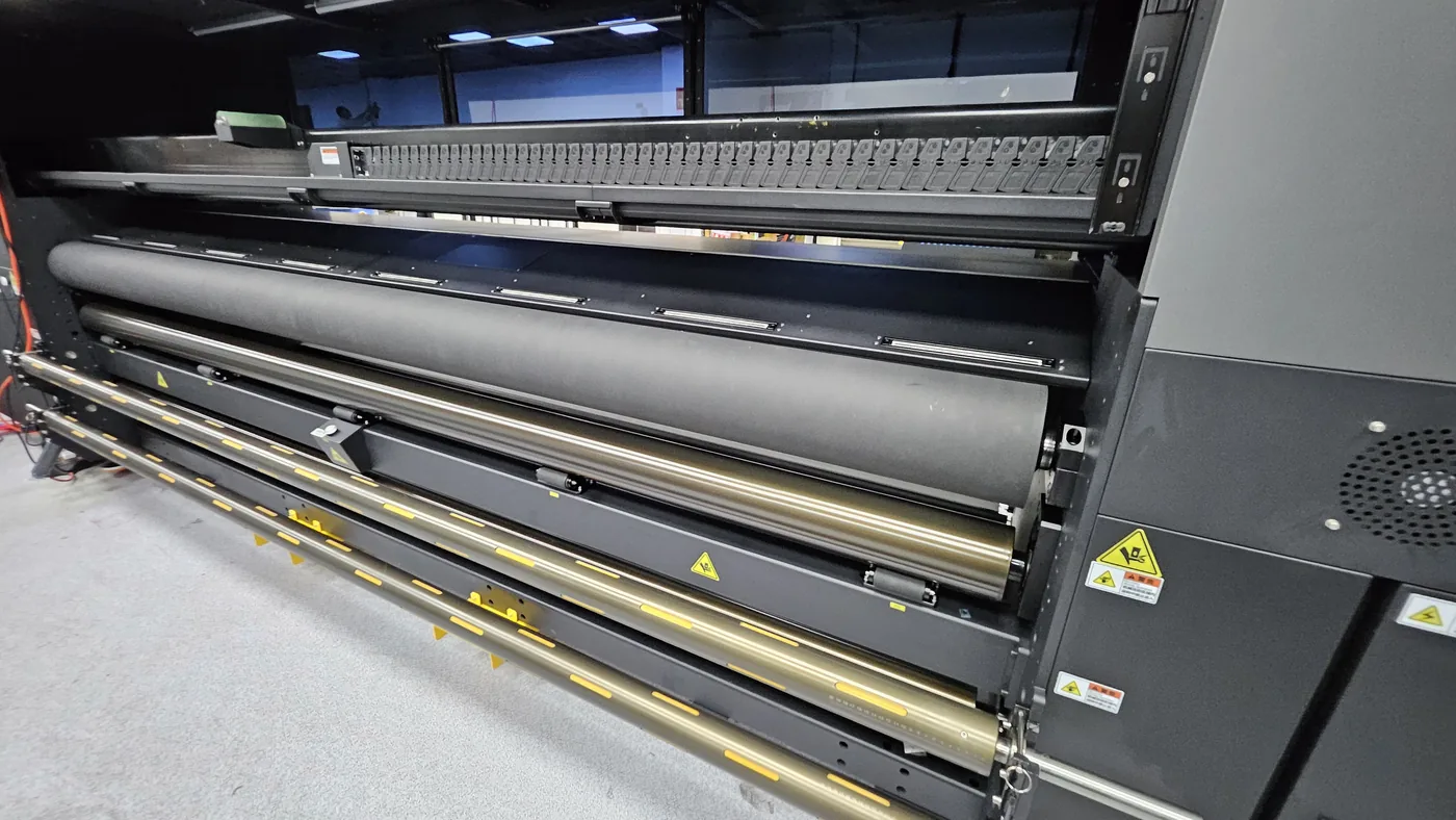 Media feed and tension rollers